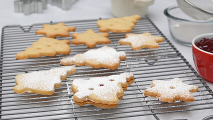 Christmas shortbread cookies with raspberry jam recipe, close up baking process. Baked cookies close up on cooling rack