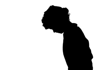 silhouette of a small boy peering down at an object.