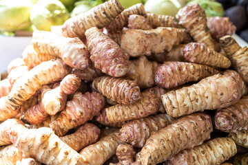 Fresh pink Jerusalem artichoke in the box for sale in the market