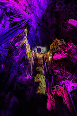 Saint Michael's Cave with colorful lights with Angel. Natural Rock Formation. Gibraltar, UK. Nature Background