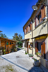 A narrow street between the old stone houses of Civitavecchia di Arpino, a medieval village in the Lazio region, Italy.
