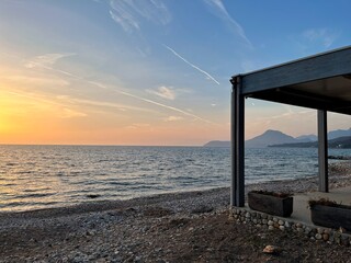 Sunrise background image, shore at dusk, pier at sunset, spa hotel by the sea