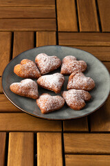 heart shaped donuts on wooden table