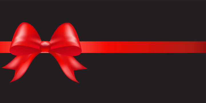 Shiny red color satin ribbon on black background