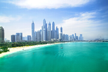 Obraz premium Dubai Marina skyscrapers, complex of residential and office buildings with beautiful white sand beaches. Dubai, UAE