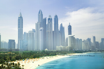 Obraz premium Dubai Marina skyscrapers, complex of residential and office buildings with beautiful white sand beaches. Dubai, UAE