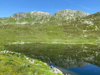 Summer atmosphere on the Lago di Rodont lake (Lake Rodont) in the Swiss alpine area of the mountain...
