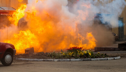 explosion with fire and smoke on the city street