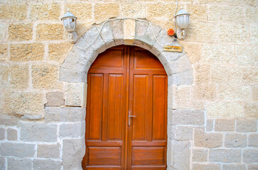 Fototapeta na wymiar old wooden door in a wall