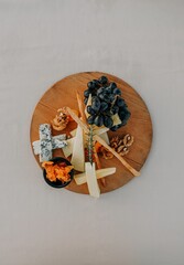 Vertical shot of a cheese platter on a white background
