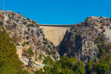 Unconventional summer holidays destinations. Concrete Oympinar Dam built on the Manavgat river in Turkey. Beautiful weather, clear blue sky. High quality photo