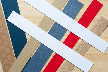 various paper stripes on wood