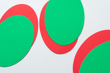 christmas green and red ovals on blank paper