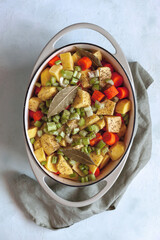 Oval cast iron stewpan with mixed vegetables