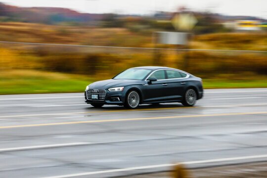 Black Audi S5 car on a highway in fall, Dundas, Canada