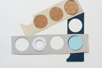 paper discs and stencils with circle shape cutouts