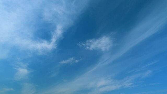Clouds in tropical summer sunshine day. White cirrus cloud or cirrostratus cloudscape. Timelapse.