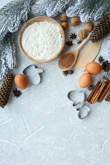 Fototapeta na wymiar Ingredients for cooking christmas baking. Flour, eggs, brown sugar and spices. Top view with copy space