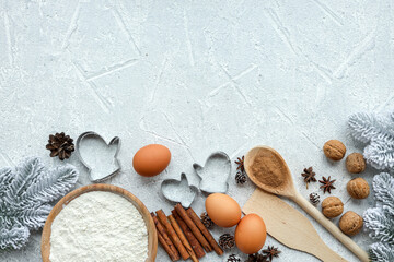 Ingredients for cooking christmas baking. Flour, eggs, brown sugar and spices. Top view with copy space