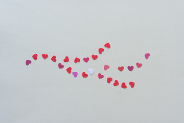 mini paper hearts on blank paper