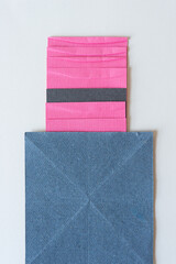 gray blue paper and pink paper with texture and stripe