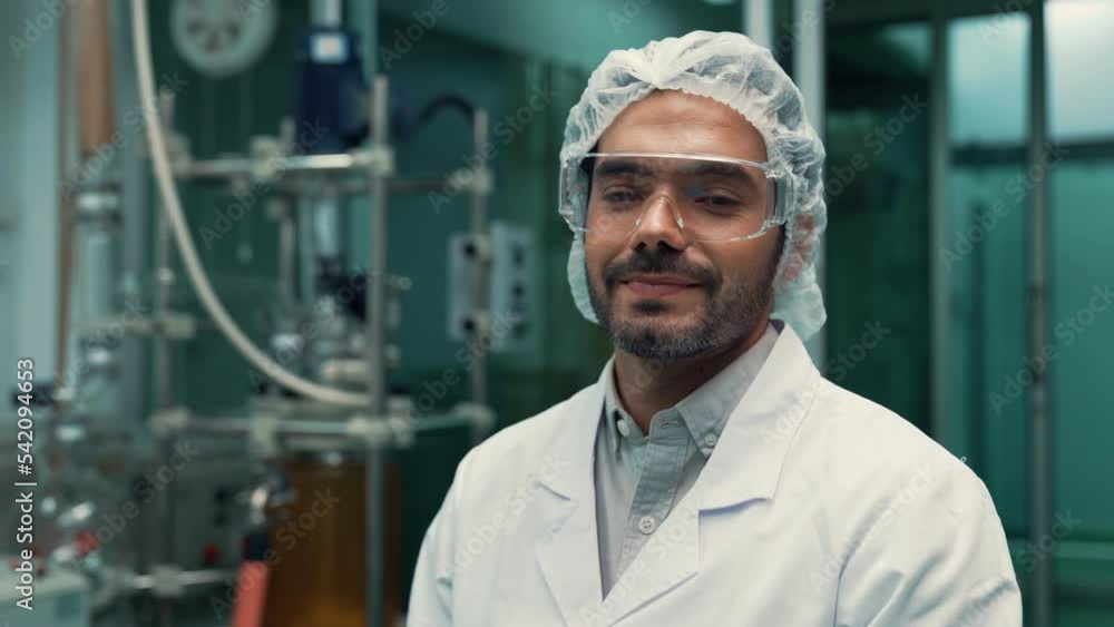 Poster portrait of a man scientist in uniform working in curative laboratory for chemical and biomedical ex