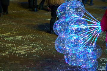 Glowing balloons in the dark of night. Background or background with selective focus and copy space