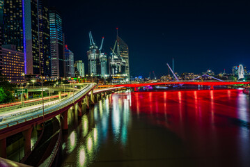 Brisbane city and river at night with colorful lights