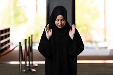 Young Beautiful Muslim Woman Praying in Mosque