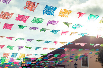 Colourful Mexican street decorated with color papers 