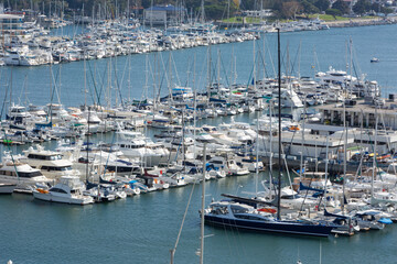 Marina Del Rey, California, USA – October 12, 2022: High Close-up View of Yacht Clubs at Marina Del Rey with Beach, Boat Pier Docks, Boats, and Houses