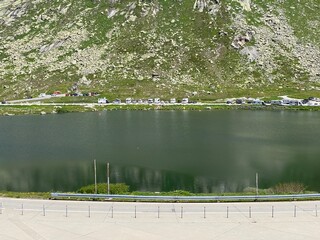 Summer atmosphere on the Lago della Piazza lake (Lake of the Piazza) in the Swiss alpine area of the mountain St. Gotthard Pass (Gotthardpass), Airolo - Canton of Ticino (Tessin), Switzerland (Schweiz