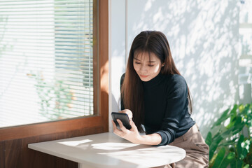 Asian working woman hold mobile phone text message, chat conversation, using social media....