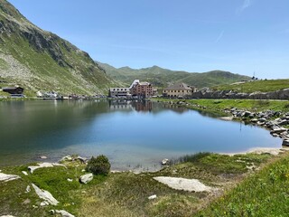 Summer atmosphere on the Lago della Piazza lake (Lake of the Piazza) in the Swiss alpine area of the mountain St. Gotthard Pass (Gotthardpass), Airolo - Canton of Ticino (Tessin), Switzerland (Schweiz