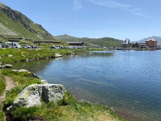 Summer atmosphere on the Lago della Piazza lake (Lake of the Piazza) in the Swiss alpine area of the mountain St. Gotthard Pass (Gotthardpass), Airolo - Canton of Ticino (Tessin), Switzerland (Schweiz