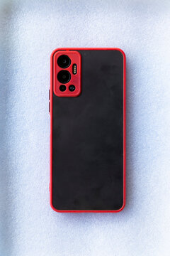 the back of the red smartphone case on a white background
