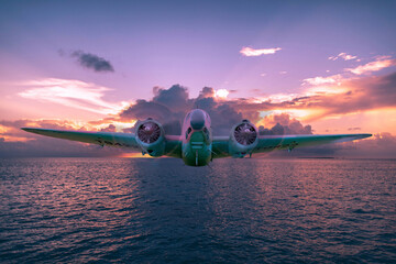 A Lockheed Hudson Bomber goes for a sunset flight over an ocean. Digital art - this plane is actually on display at the North Atlantic Aviation Museum in Gander, Newfoundland. - obrazy, fototapety, plakaty