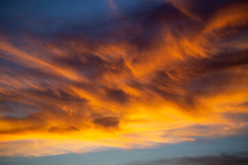 Colorful clouds light up sky at sunset