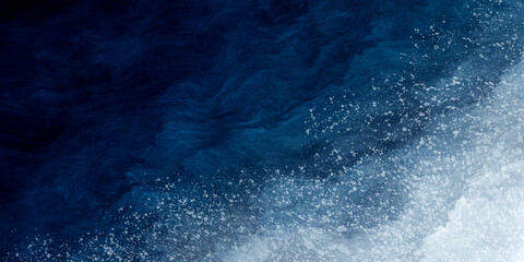 Abstract blue paint background with white splatter like snow grunge texture vintage style in concept winter, ocean, sky.
