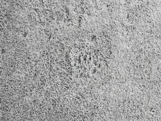 Obraz premium Textured gray concrete surface with a rough finish. Close-up of a weathered gray concrete texture, perfect for backgrounds. Detailed view of smooth concrete surface in a minimalist style