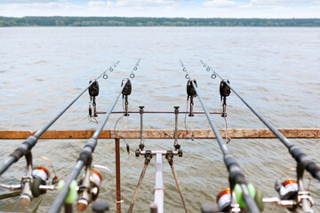 Four thrown fishing rods with equipped Fishing Bite Alarm.