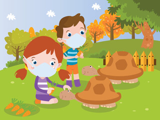 Kids feed turtles with carrots in the zoo