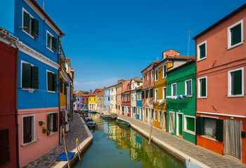 Fototapeta na wymiar Colorful facades on a street at Burano island in Venice, Italy