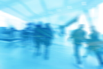 Obraz premium group of people movement blurred light background inside