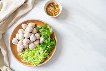 pork meatball with vegetable and spicy sauce