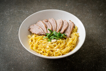 dried duck noodles in white bowl