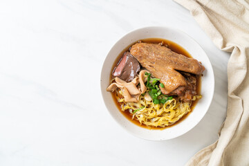 egg noodles with stewed and braised duck in brown soup