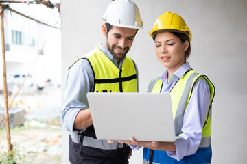 Engineers on building site. Engineer are working contruction on site plans to build high-rise buildings building. Architect caucasian man working with colleagues mixed race in the construction site.