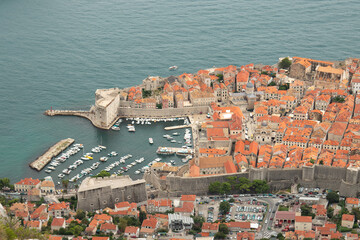 The old town of Dubrovnik (Dalmatia, Croatia) lying in the Adriatic Sea as seen from a mountain. 