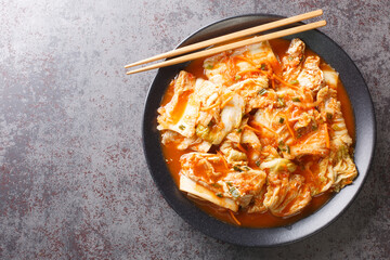 Kimchi is a traditional Korean side dish of salted and fermented vegetables, such as napa cabbage,...